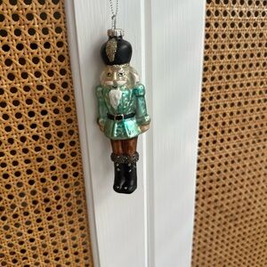 Elegant Nutcracker Ornament in Black and Green